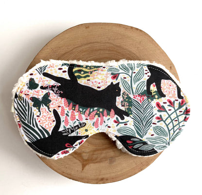 Front view of Jungle Cat Sleep Mask showcasing vibrant cotton fabric with jungle-themed cat and leaf pattern for soothing sleep.