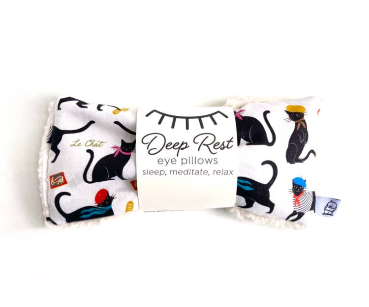 Deep Rest Eye Pillow with black cat print, designed for relaxation and meditation. Soft fabric ideal for stress relief and sleep support.
