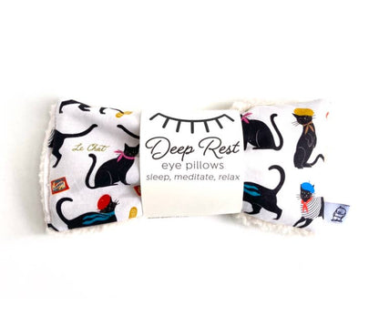 Deep Rest Eye Pillow with black cat print, designed for relaxation and meditation. Soft fabric ideal for stress relief and sleep support.
