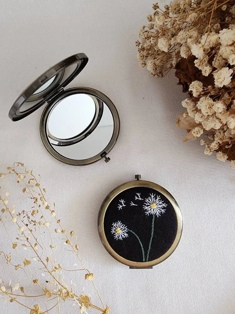 Black linen Floral Compact Mirror with white embroidered flowers, from Sophia Collection, a chic and practical gift for her.