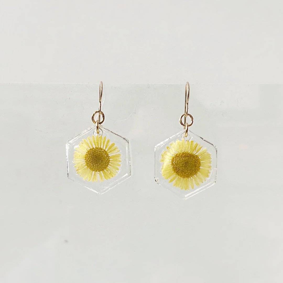 Hexagon resin earrings with yellow daisy flowers and gold hooks. From the Real Flower Earrings - Gold and Silver Posts series.
