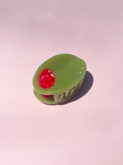 Olive Claw Clip - Cellulose Acetate | Durable, Stylish Accessory shaped like a green olive with red pimento and rhinestone accents.
