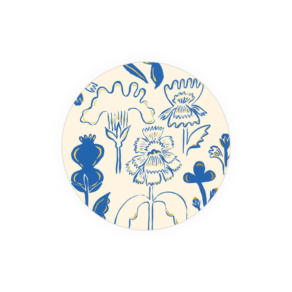 Corked-backed coaster with blue flower design on cream background, heat and water resistant for stylish table protection.
