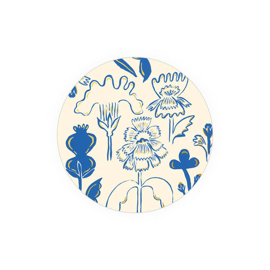 Corked-backed coaster with blue flower design on cream background, heat and water resistant for stylish table protection.