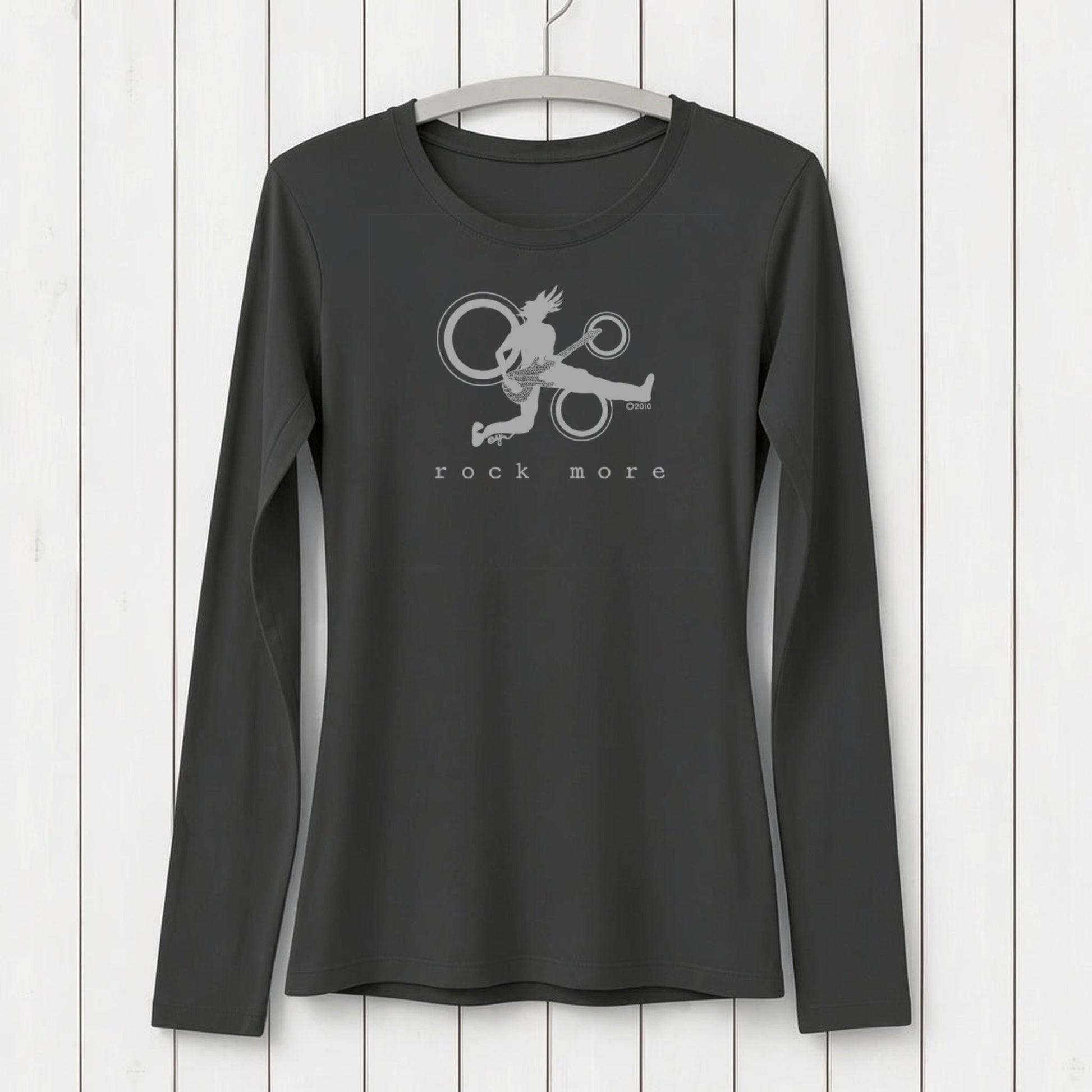 Black long sleeve T-shirt with a graphic of a fairy playing guitar and circular musical elements, featuring the text 'rock more' in white, made of sustainable bamboo and organic cotton, SKU: WLSXSNAV