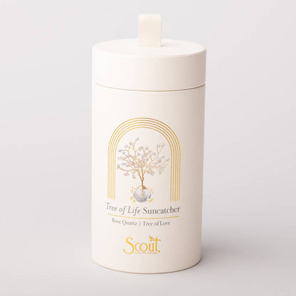 Elegant cylindrical packaging for Rose Quartz Suncatcher - Tree of Life by Scout, featuring gold foil design and product illustration.
