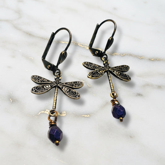 Brass dragonfly earrings with purple bead dangles