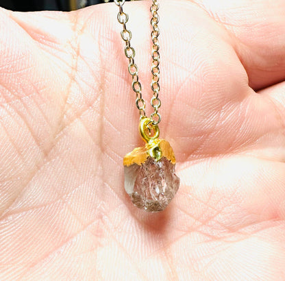 Set of raw gemstone necklaces featuring aquamarine, Herkimer, and purple gemstone pendants