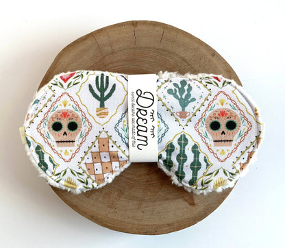 Frida White Print Sweet Dreams Sleep Mask with vibrant skull and cactus design, crafted from 100% cotton and soft minky for ultimate comfort.
