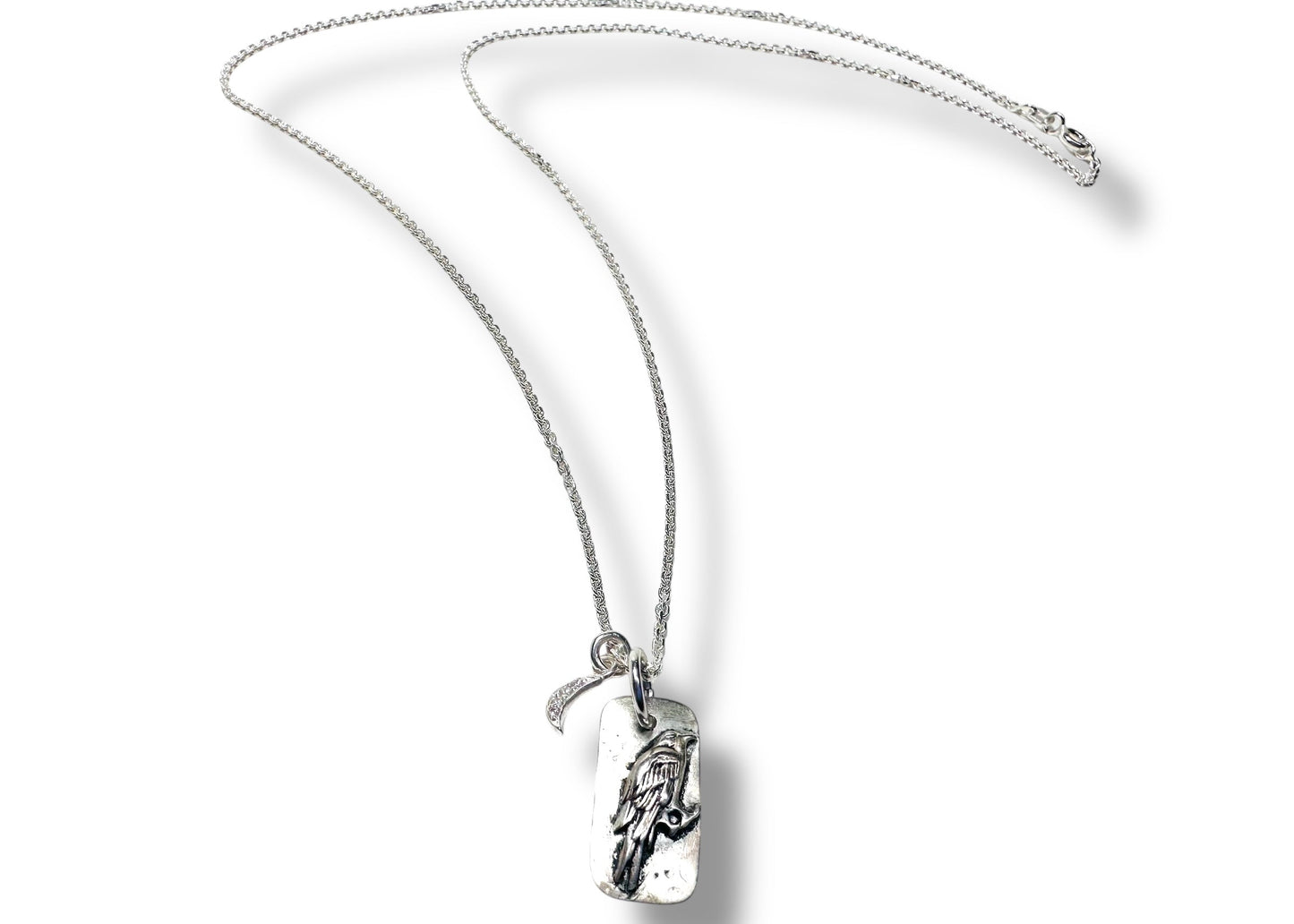 Silver chain necklace with engraved pendant and moon charm
