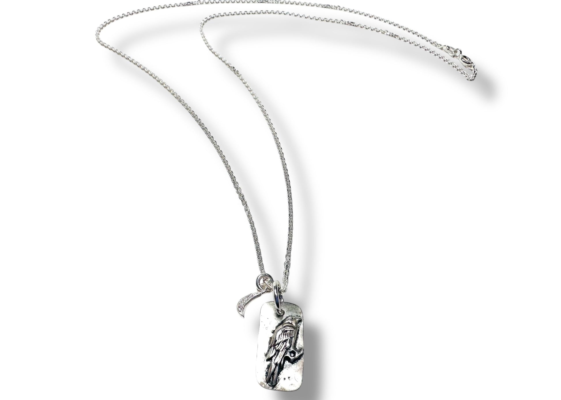 Silver chain necklace with engraved pendant and moon charm