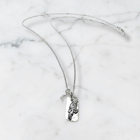Silver chain necklace with engraved pendant and moon charm