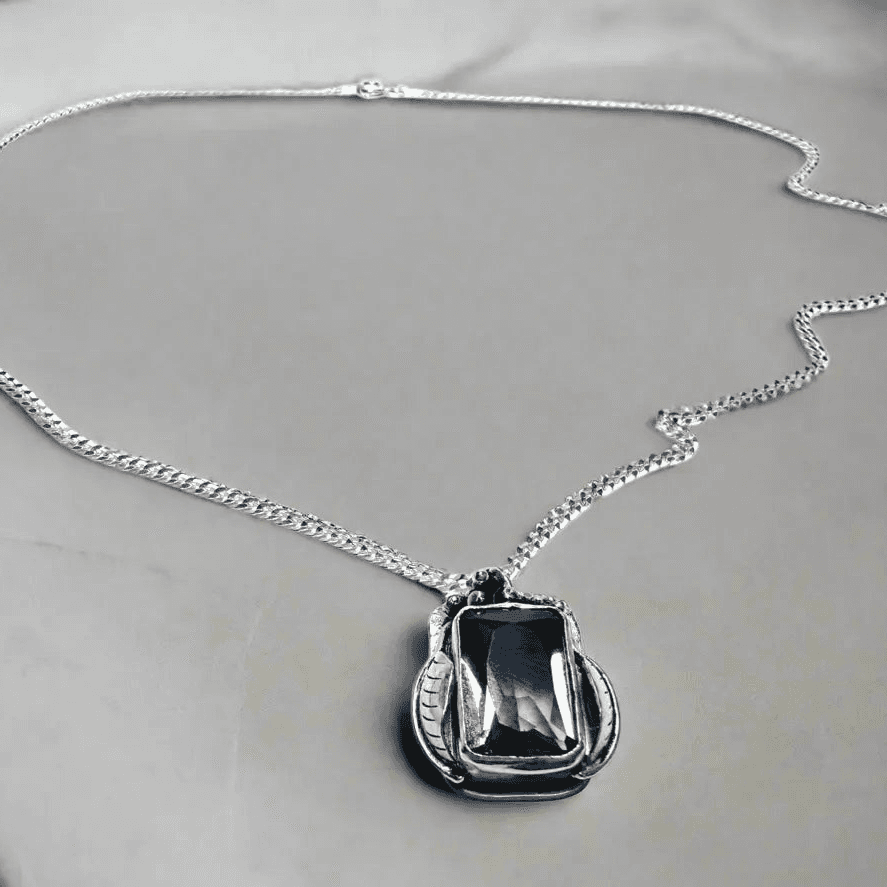 Amethyst Grapes Wine Necklace with rectangular gemstone pendant on sterling silver chain, handcrafted in a grapevine-inspired design.