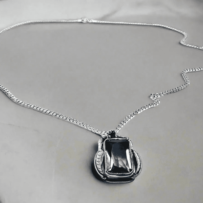 Amethyst Grapes Wine Necklace with rectangular gemstone pendant on sterling silver chain, handcrafted in a grapevine-inspired design.