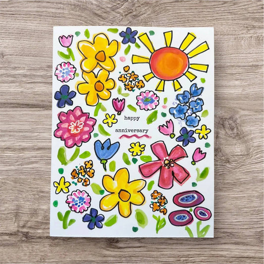 Anniversary Card - Handmade Inspirational Greeting Cards featuring colorful hand-painted flowers and sun with 'happy anniversary' text in center. Ideal for celebrating love and positivity with unique, artistic design.