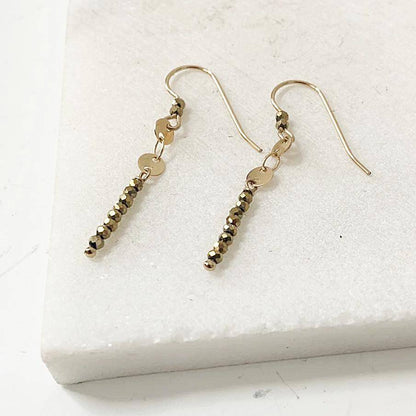 Close-up of Dainty Gemstone Earrings - Gemstone Silver Earrings featuring faceted hematite beads and minimalist gold bar design. Ideal for chic accessorizing.