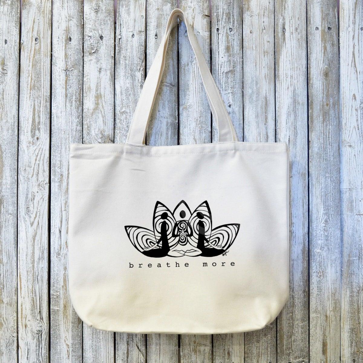 Organic Yoga Tote Bag with 'BREATHE MORE' artist design in black ink on 100% cotton canvas. Eco-friendly and ideal for yoga lovers or mindful gifting.