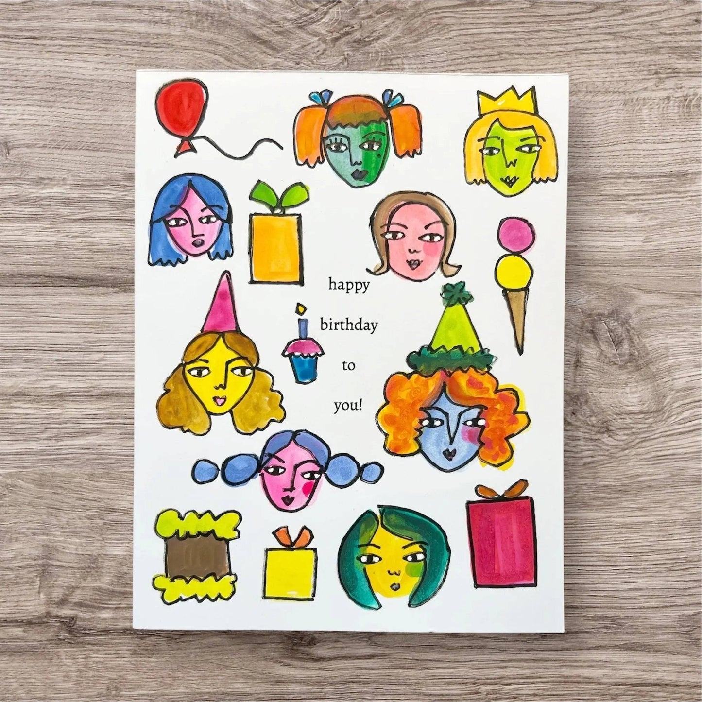 Inspirational Handmade Greeting Card with colorful party faces, gifts, and 'happy birthday to you!' text, perfect for cheerful celebrations.