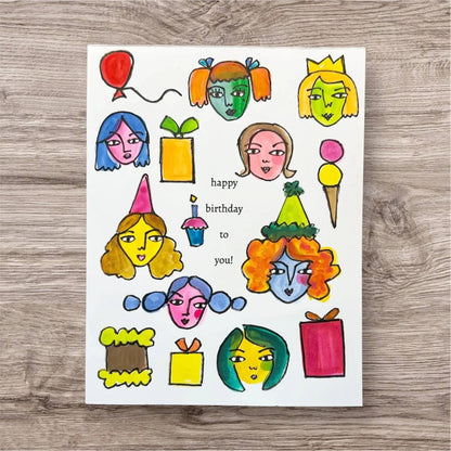 Inspirational Handmade Greeting Card with colorful party faces, gifts, and 'happy birthday to you!' text, perfect for cheerful celebrations.