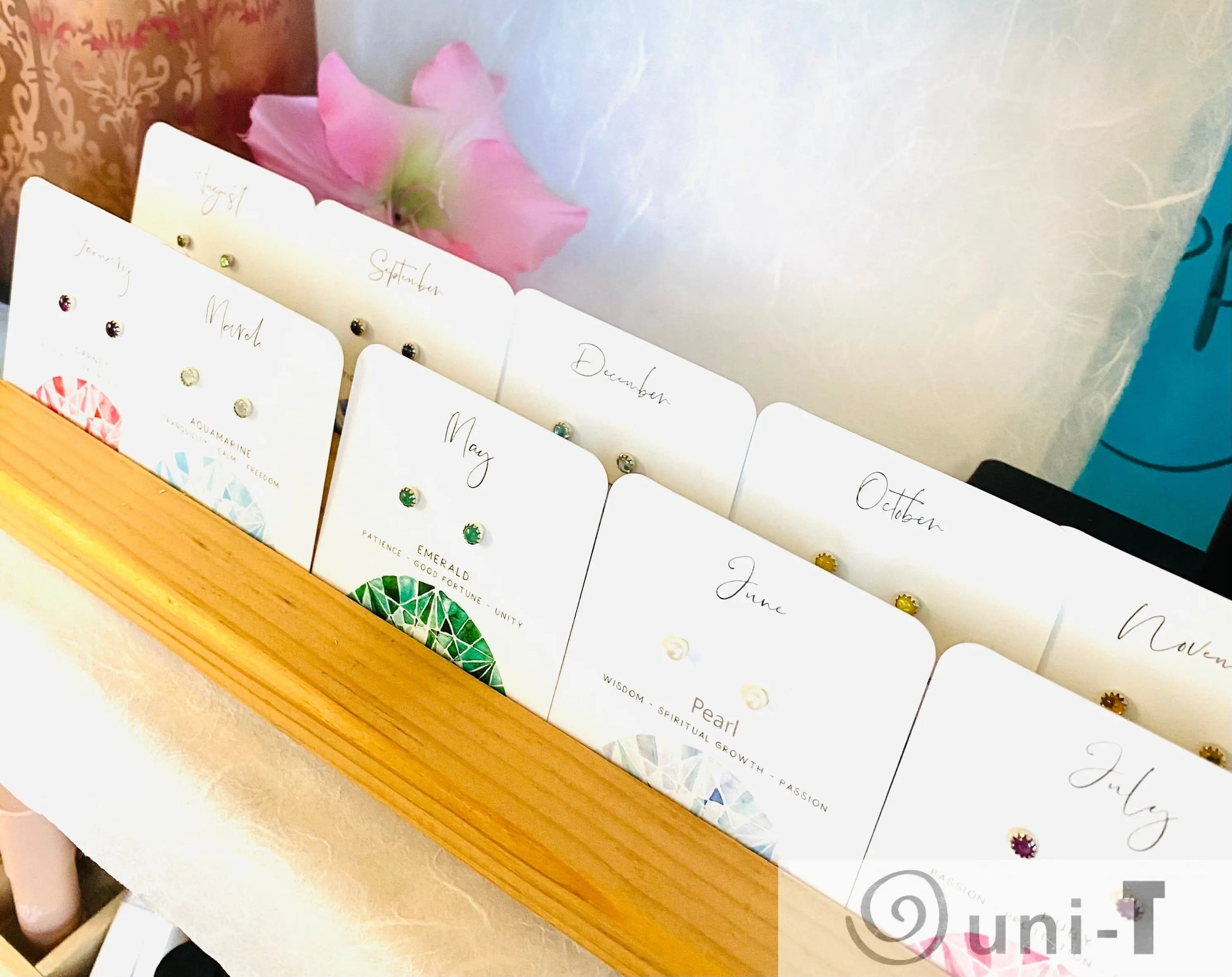 Display of Birthstone Studs - Silver Earrings | Genuine Gemstones arranged by month, ideal for birthday gifts and personal jewelry collections.