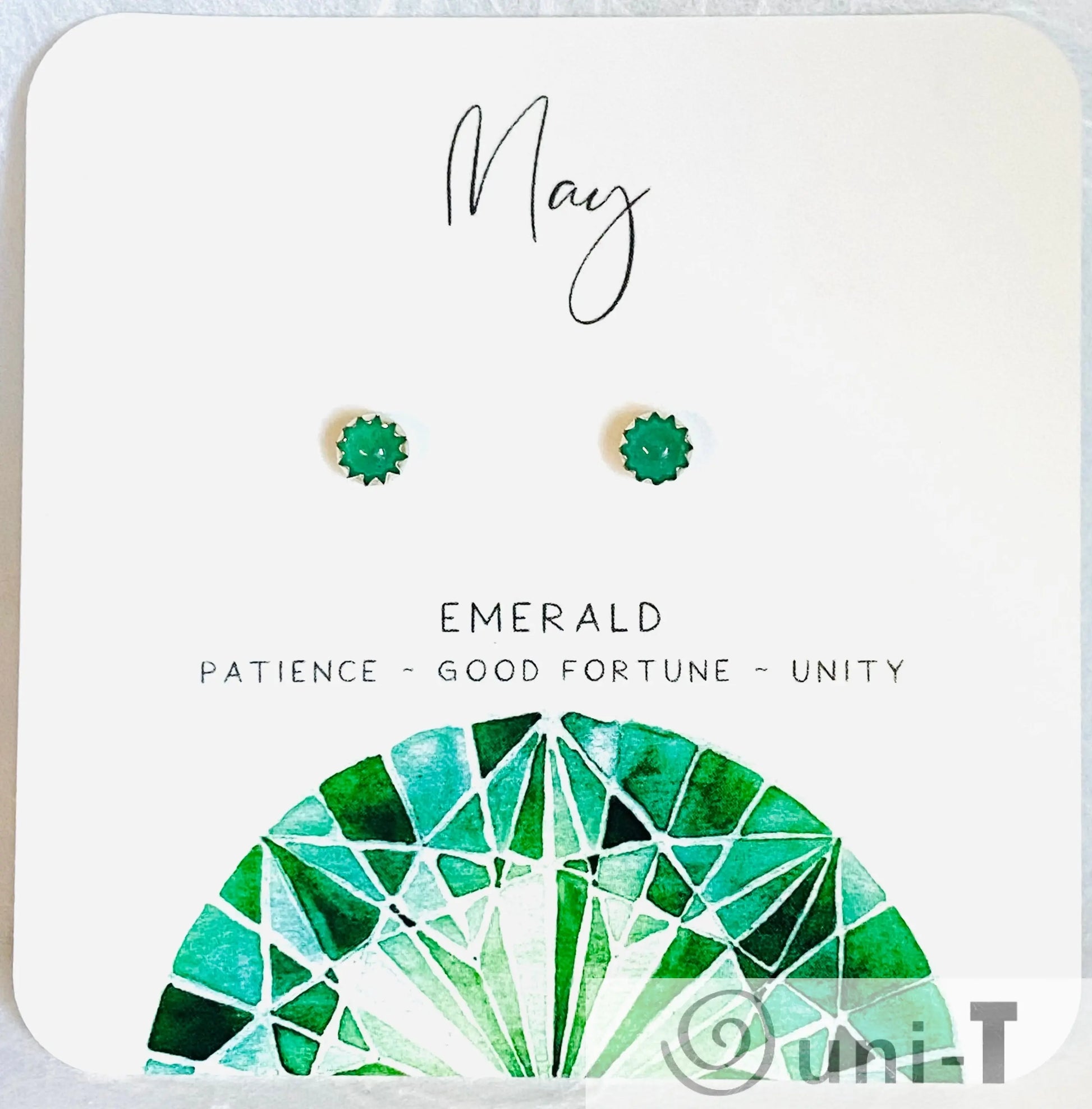 May birthstone emerald silver studs featuring vibrant green gemstones, representing patience and unity, perfect for jewelry lovers.