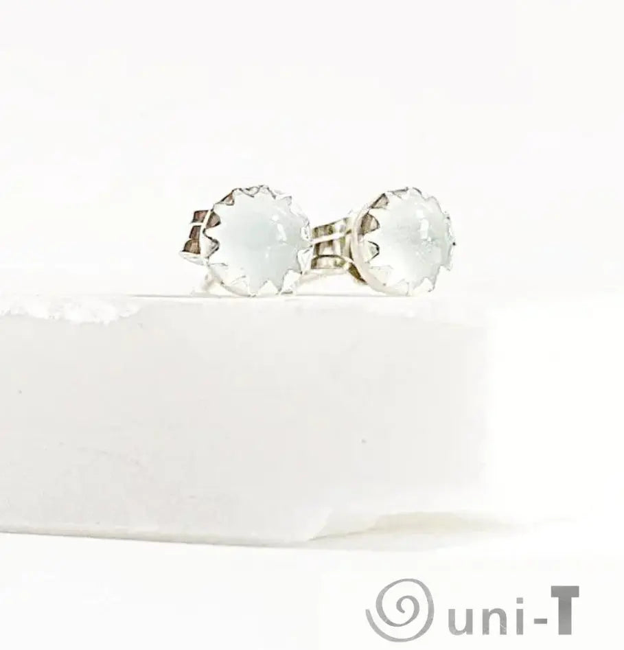 Close-up of aquamarine birthstone silver studs with light blue gemstones, ideal for March birthdays and elegant daily wear.