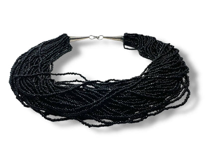 Black Beaded Necklace - Vintage Style Jewelry featuring layered strands of small black glass beads with a twisted design, ideal for statement looks.