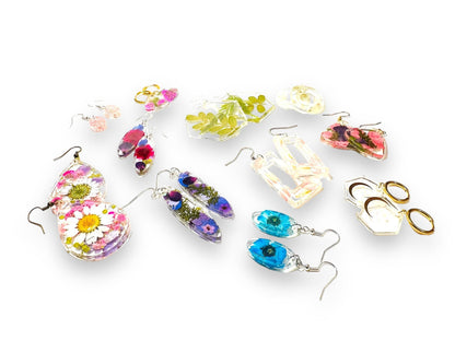 Colorful collection of resin earrings with real flowers and mixed metal hooks. Unique pressed flower earrings in assorted styles.