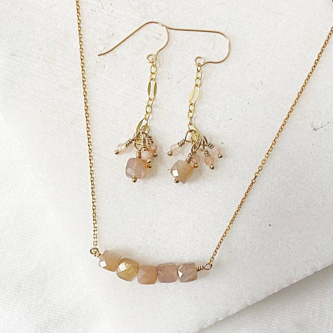 Gemstone Gold Earrings Necklace Set featuring dainty peach moonstone beads on 14k gold fill chain and drop earrings with clustered charms.