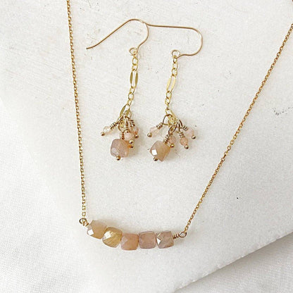 Gemstone Gold Earrings Necklace Set featuring dainty peach moonstone beads on 14k gold fill chain and drop earrings with clustered charms.