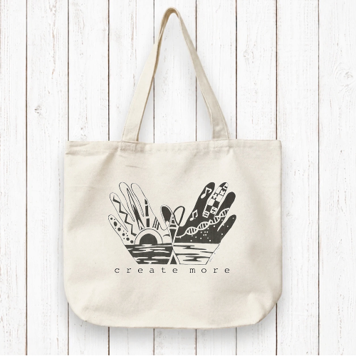 Create More with Organic Canvas Artist Tote Bag featuring illustrated hands and creative elements. Eco-friendly and ideal for artists and creators.