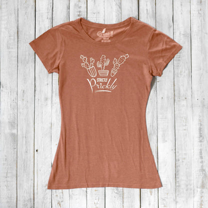Eco-friendly cactus t-shirt for women in rust color with 'Strictly Prickly' graphic. Made from bamboo and organic cotton for sustainable fashion.