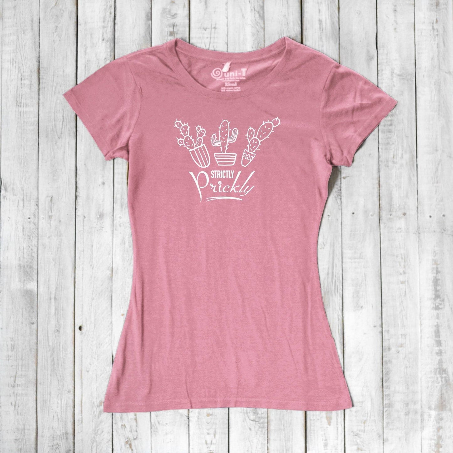 Pink cactus t-shirt for women featuring white 'Strictly Prickly' design. Soft bamboo and organic cotton fabric for sustainable wear.