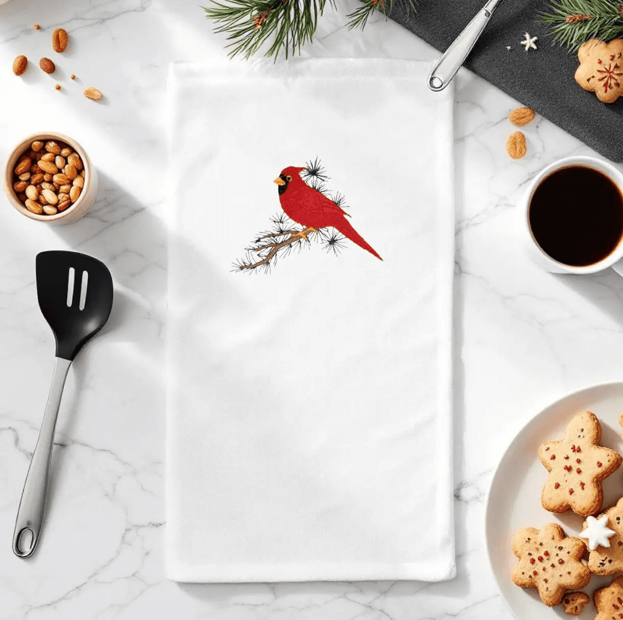 Cardinal Embroidered Towel - Nature Decor | Quality Material displayed on a festive kitchen counter with cookies, coffee, and utensils.