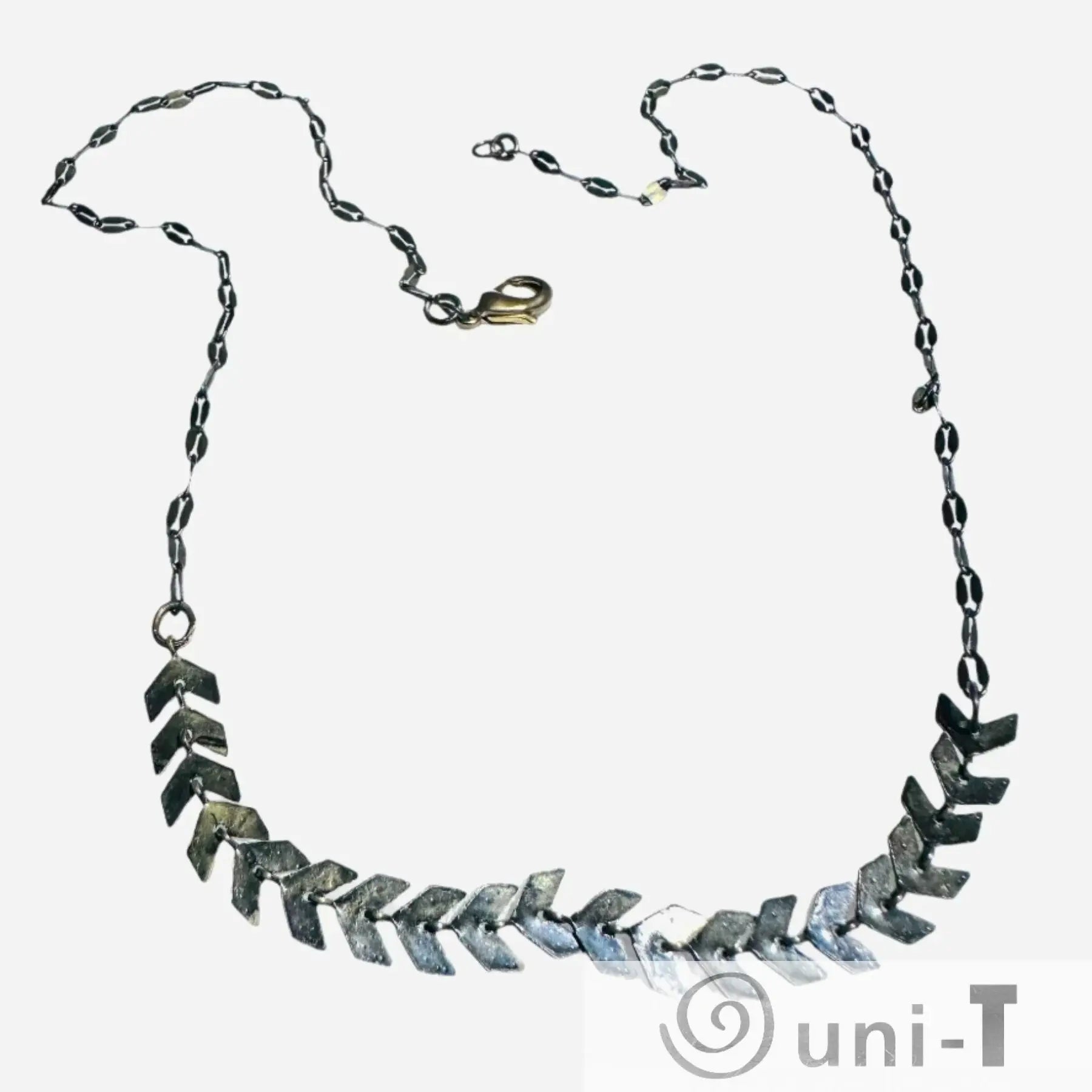 Chevron Brass Necklace - Antique Brass Chain | 16-Inch Length, showcasing chevron-shaped brass elements on a dark patina chain.