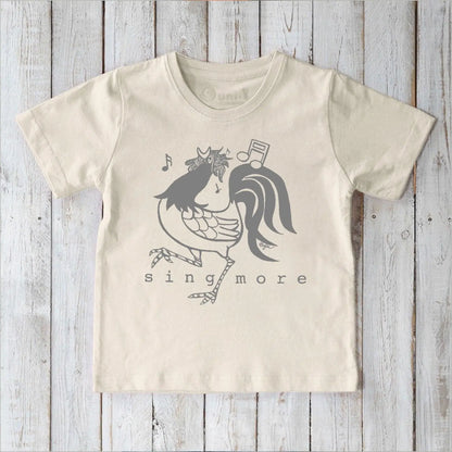 Eco-friendly kids' rooster graphic tee in cream, organic cotton shirt with 'Sing More' text, perfect for sensitive skin.