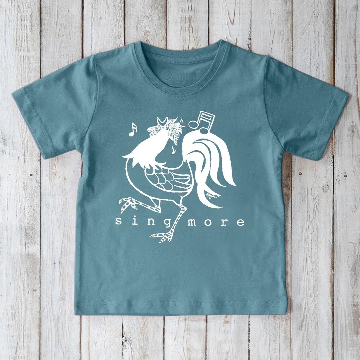 Blue kids' rooster t-shirt made from organic cotton, featuring a cheerful 'Sing More' print, ideal for eco-conscious families.