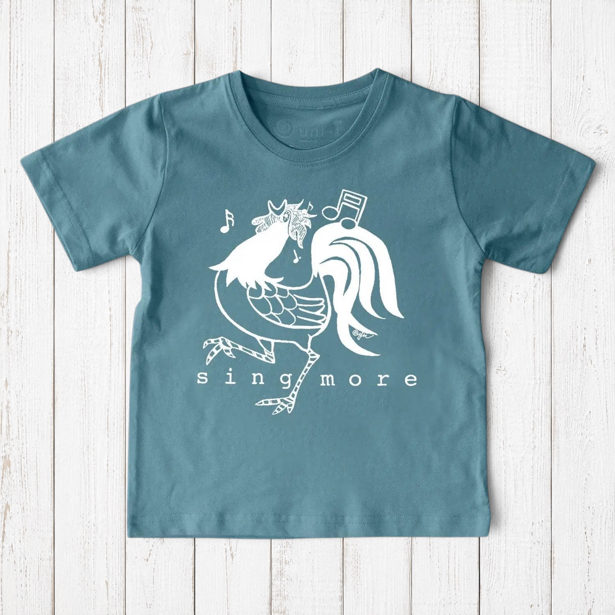 Blue kids' rooster t-shirt made from organic cotton, featuring a cheerful 'Sing More' print, ideal for eco-conscious families.