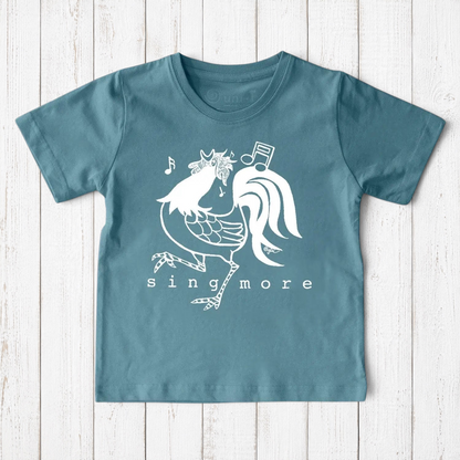 Blue kids' rooster t-shirt made from organic cotton, featuring a cheerful 'Sing More' print, ideal for eco-conscious families.