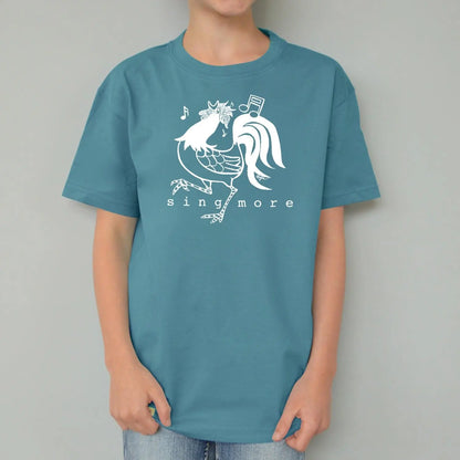 Blue organic cotton kids' t-shirt featuring a white rooster and 'Sing More' message, playful and sustainable farm-inspired design.