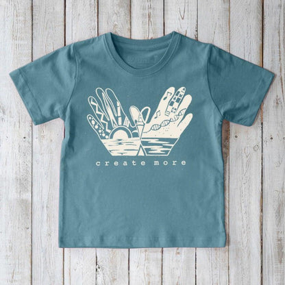 Kids' Creative Art Organic Cotton T-Shirt in blue with 'Create More' hand graphic, eco-friendly inspirational tee by Uni-T for children.
