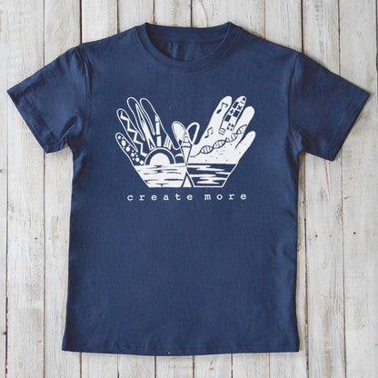 Navy blue Kids' Organic Cotton T-Shirt with white 'Create More' hand design, sustainable and artistic graphic tee by Uni-T for children.