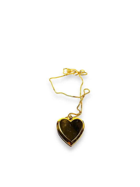 Gold heart-shaped crystal locket with black accents, brass jewelry