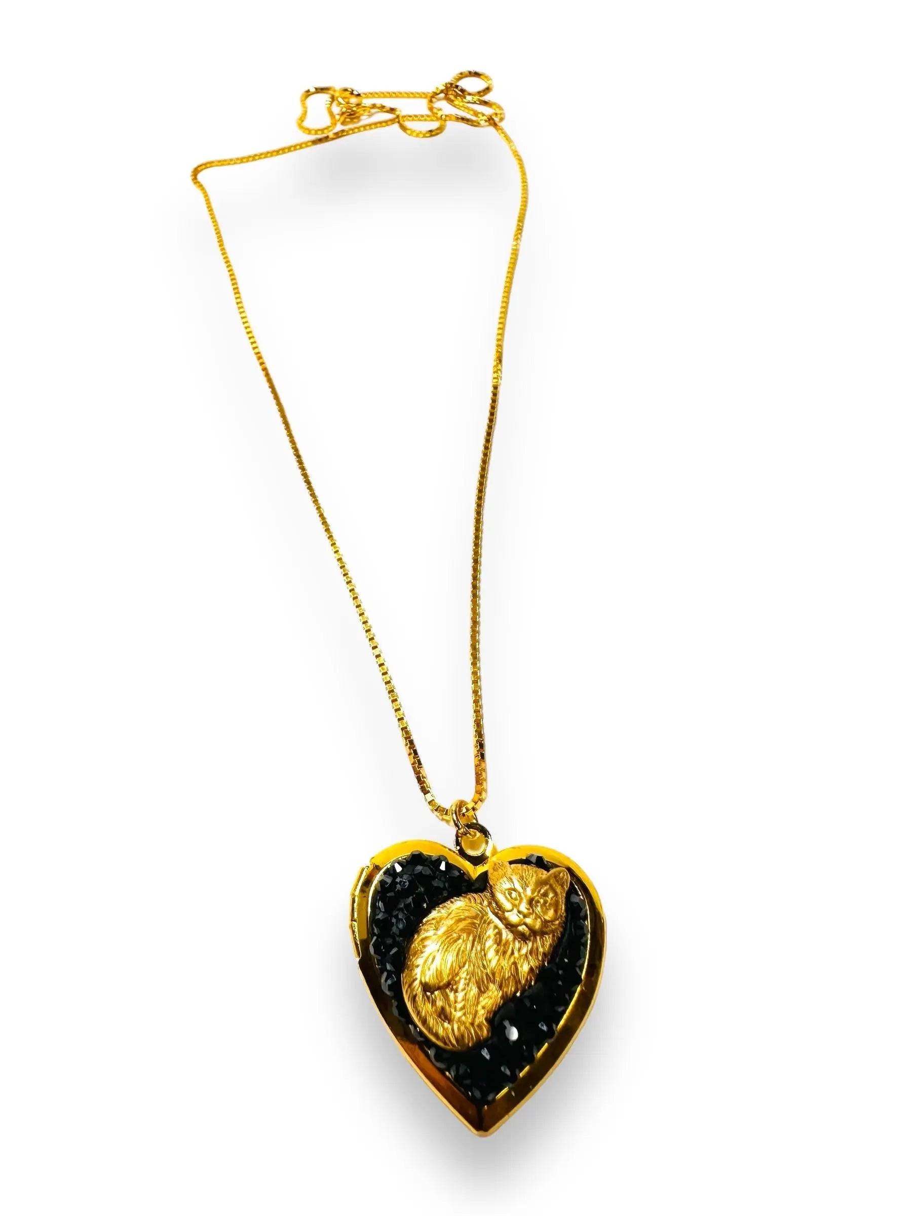 Affordable brass crystal locket with black crystal clay and a detailed gold cat figure, ideal as a unique cat-themed jewelry gift.