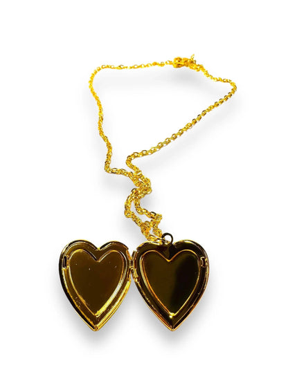 Open heart-shaped brass locket with polished gold-tone interior, perfect for personalizing with photos or tiny mementos.