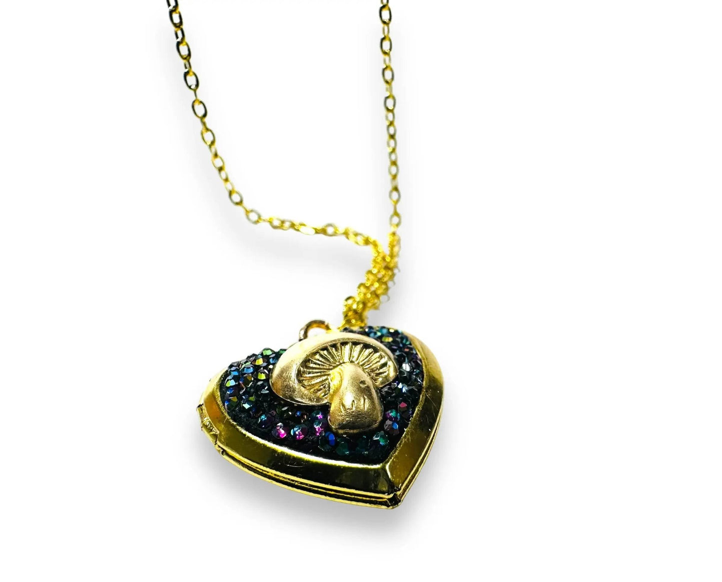 Heart-shaped brass locket with gold mushroom and rainbow crystal clay, a unique and affordable gift for nature lovers.