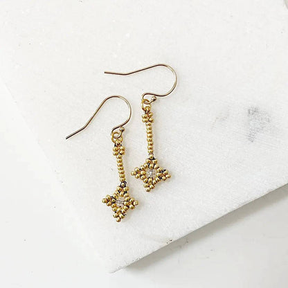 Crystal Woven Earrings in gold with delicate seed bead design and sterling silver ear wires. Elegant accessory for formal or casual wear.