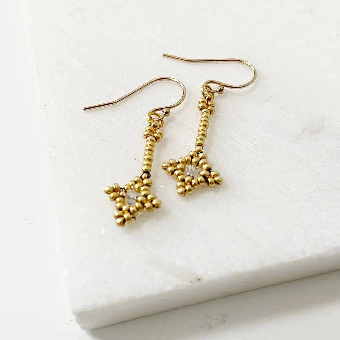 Gold Crystal Woven Earrings featuring intricate beadwork and crystal center. Lightweight and stylish for everyday elegance.