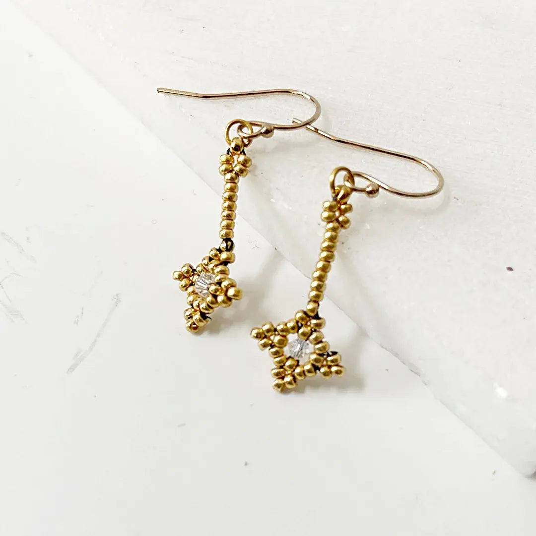 Elegant Crystal Woven Earrings with gold seed beads and clear crystal accents. Perfect handmade jewelry for gifting or accessorizing.