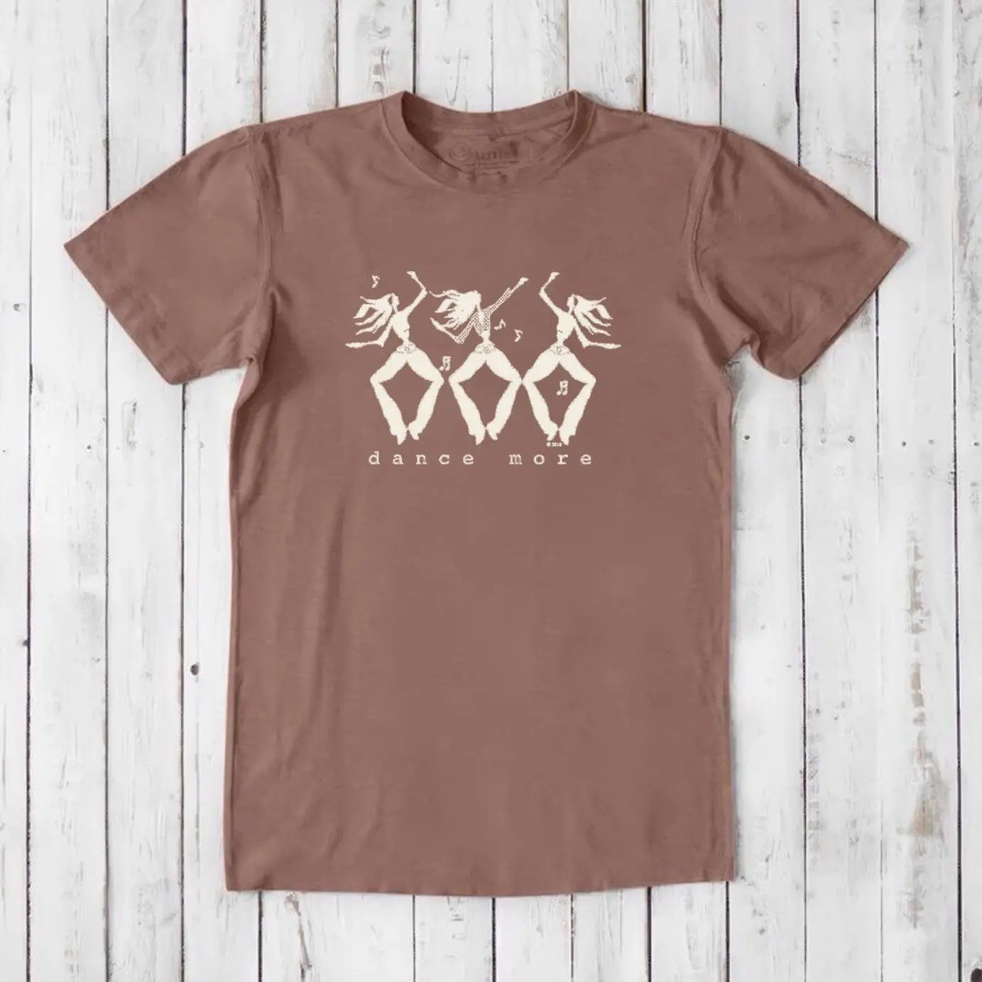 Men's Dance T-Shirt in Bamboo & Organic Cotton in dusty rose with ivory dancer graphic and 'Dance More' text. Inspirational and eco-conscious tee.